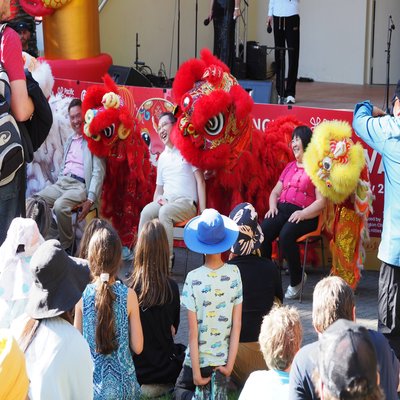 Lion dancers surround Ray, Amb Dr. Wang, Debbie